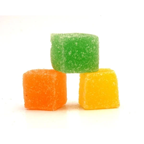 Bulk kratom gummies - green, orange, and yellow sugar-coated kratom gummy cubes